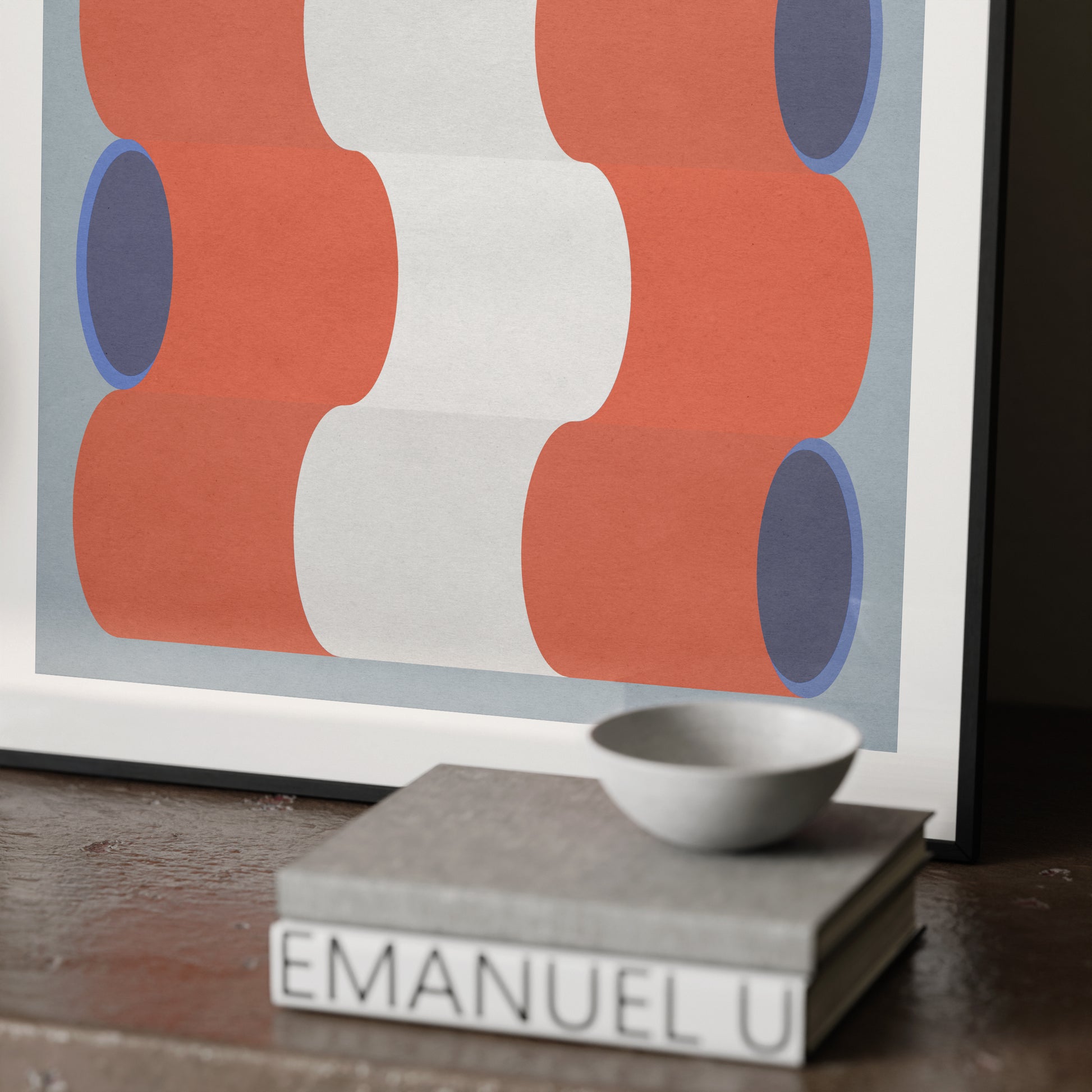 Detail of a blue, white and red graphic art print.