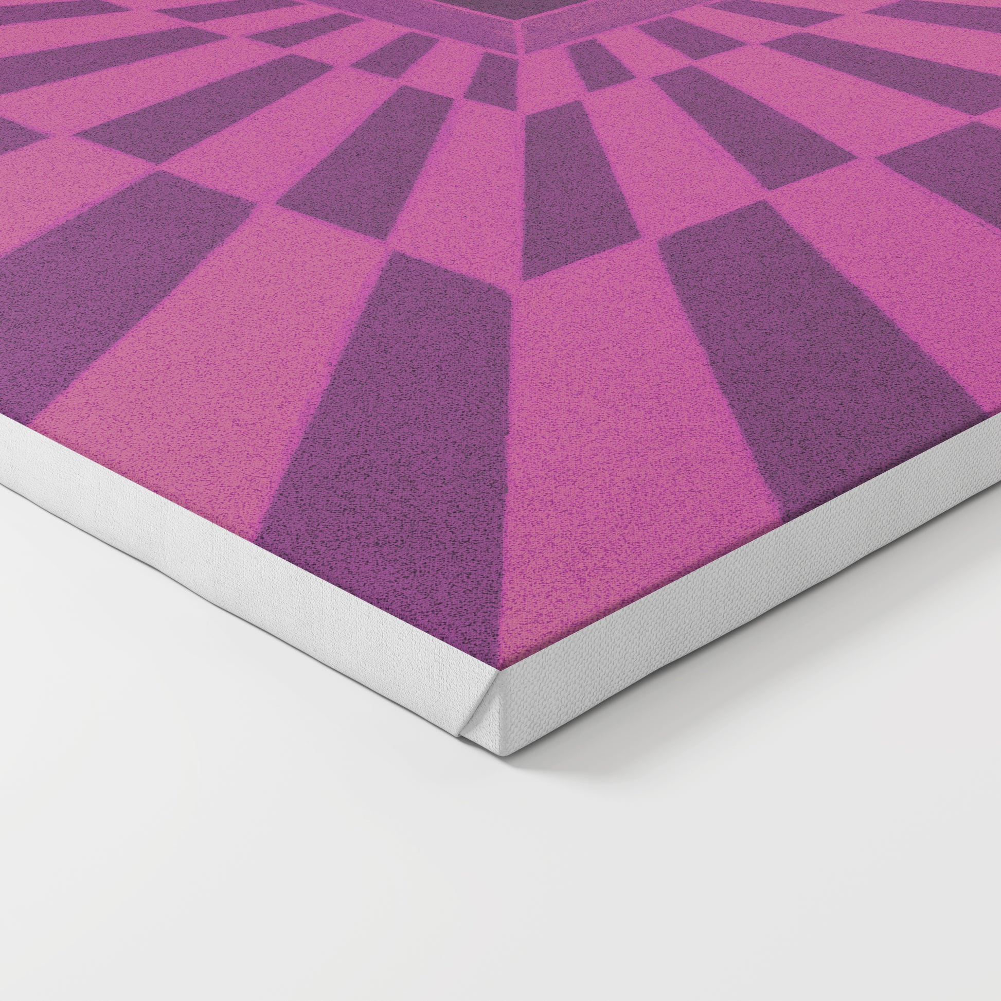 Close-up of a geometric patterned art print on canvas with pink and purple pattern.