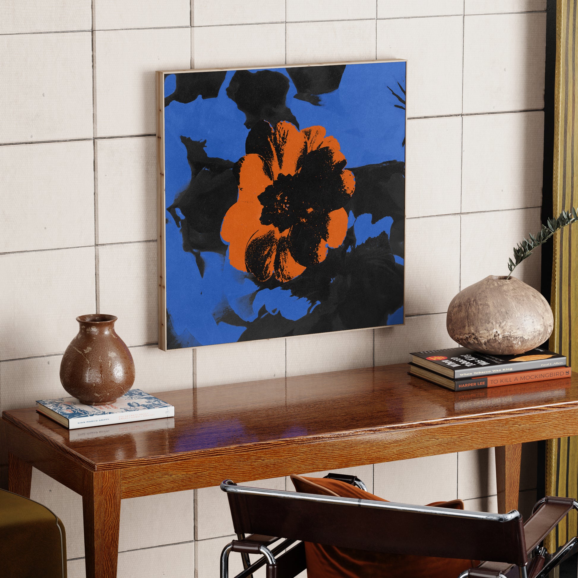 Pop art vivid canvas print with red flower on a blue background, in an eclectic interior.
