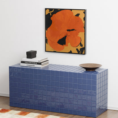 Pop art canvas print with a big red flower, in a modern interior.