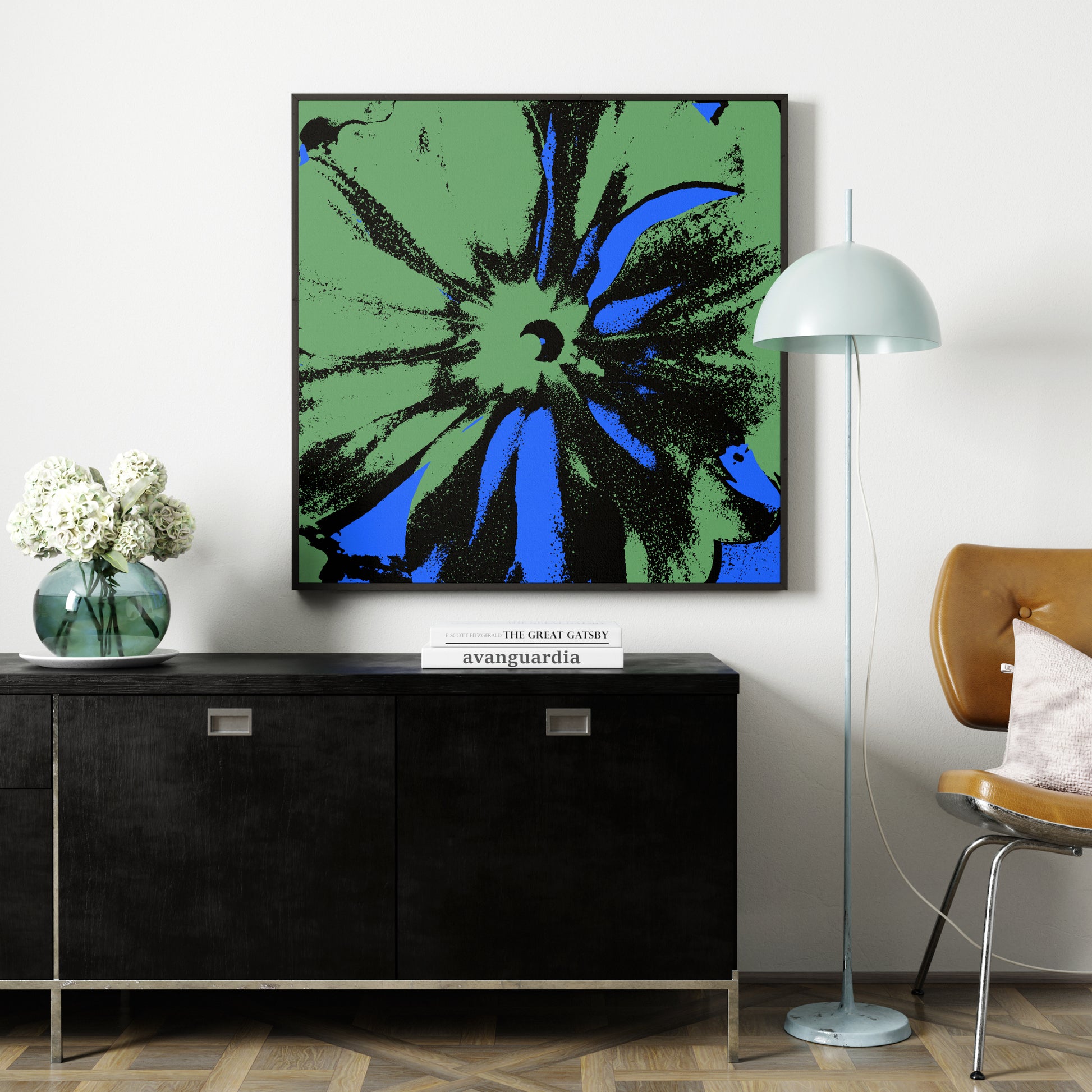 Blue and green flower pop art art print above a black sideboard.