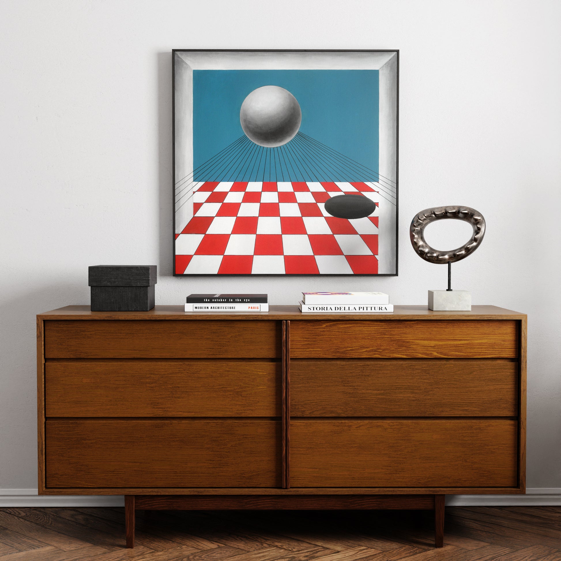 Red and blue geometric contemporary painting above a solid wood sideboard.