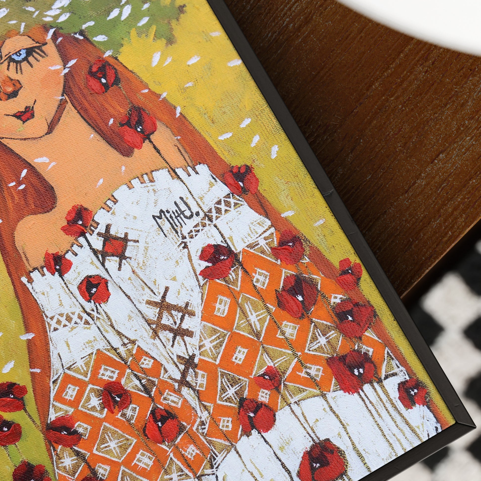 Artistic depiction of a woman with red flowers in her hair and dress, on a textured surface.