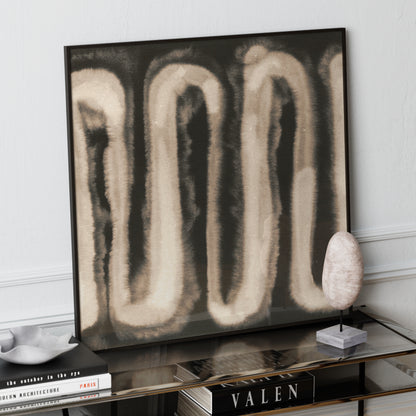 Monochrome watercolor abstract art print on a glass sideboard.