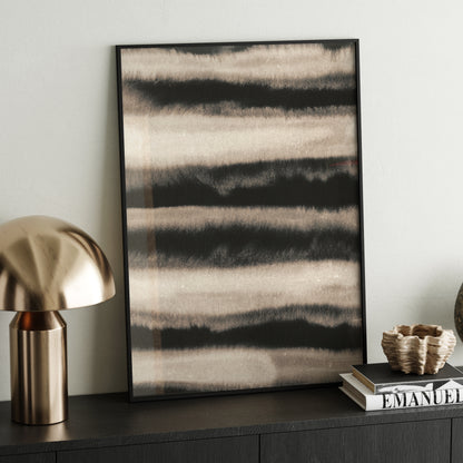 Monochrome watercolor abstract lines art print on a sideboard.