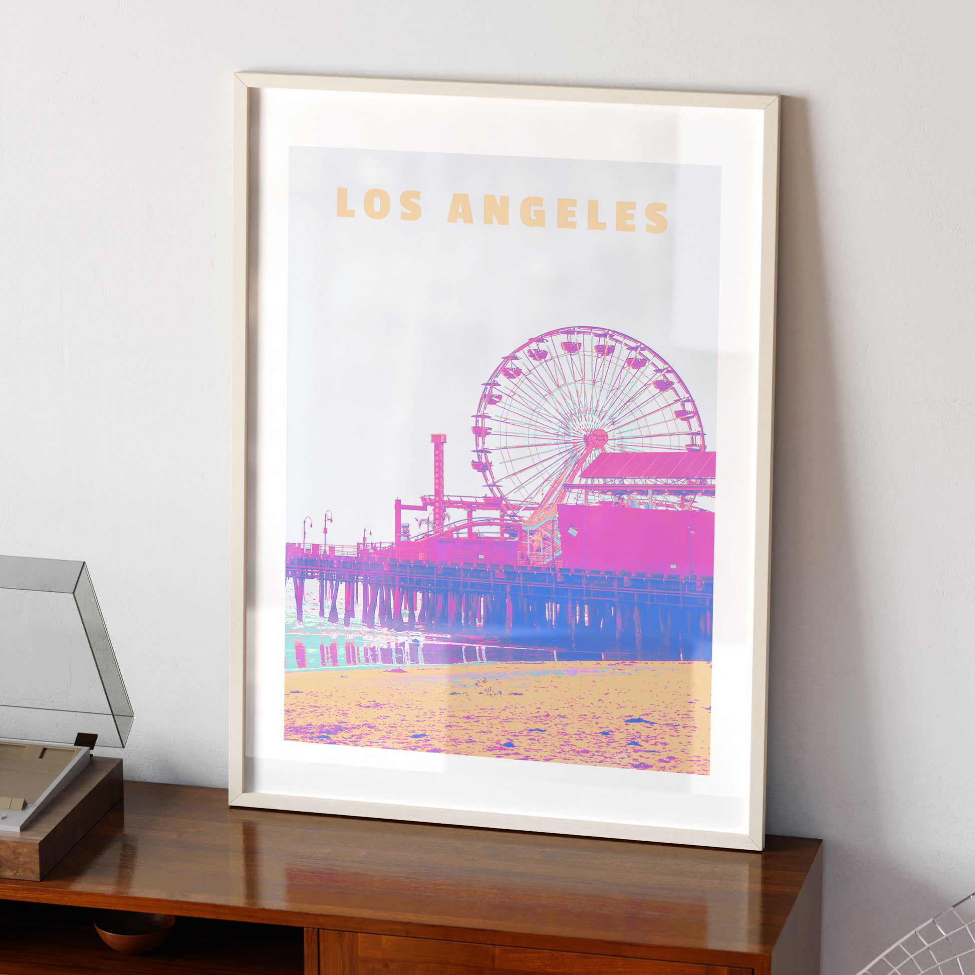 Travel poster Los Angeles landmark colorful art print on a vintage sideboard.
