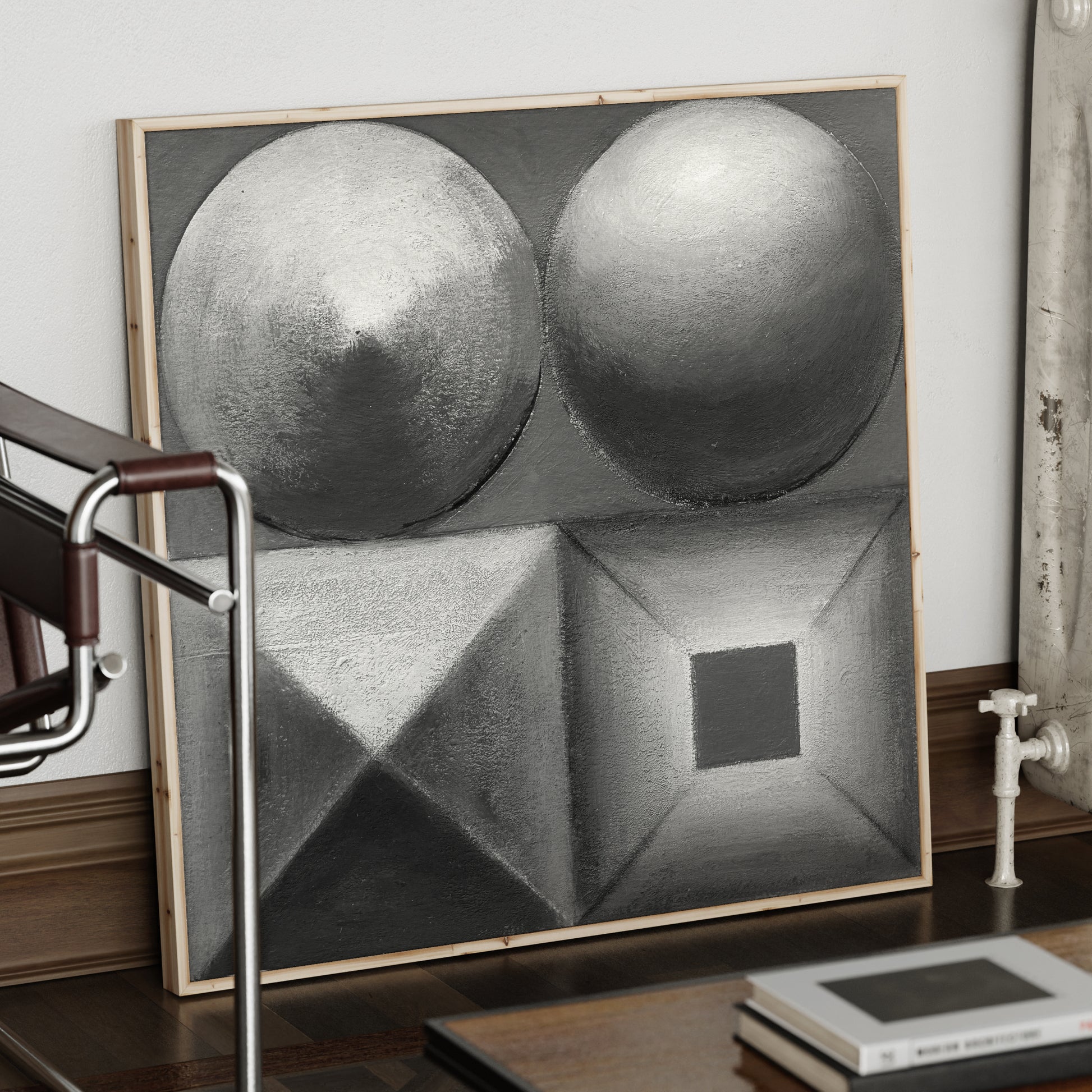 Black and white abstract geometric art print in a wood frame.