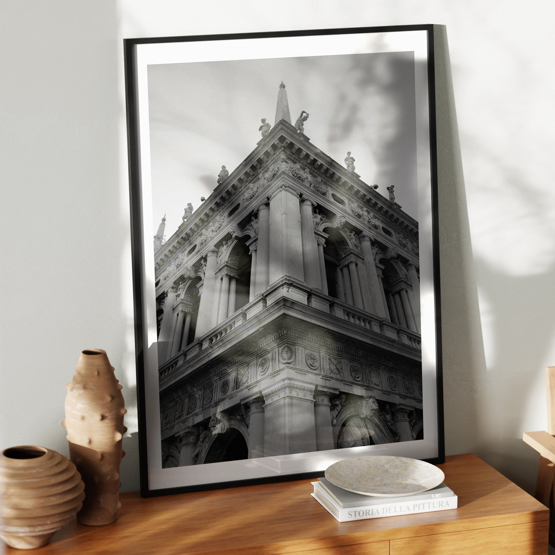 Corner of a classic Venetian building, artistic black and white photography art print in a black metallic frame.