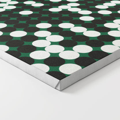 Close-up of a patterned design art print on canvas, with white and black dots on a green background.