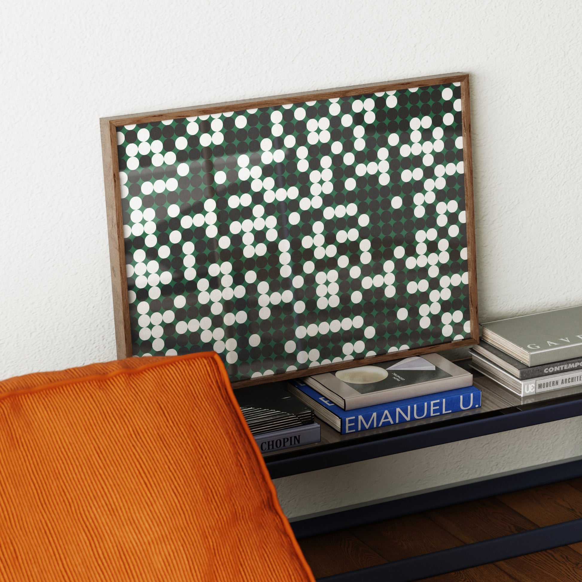 Decorative wall art with a geometric pattern on a shelf with books.