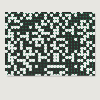 Pattern design art print on paper with white and black dots on a green background.