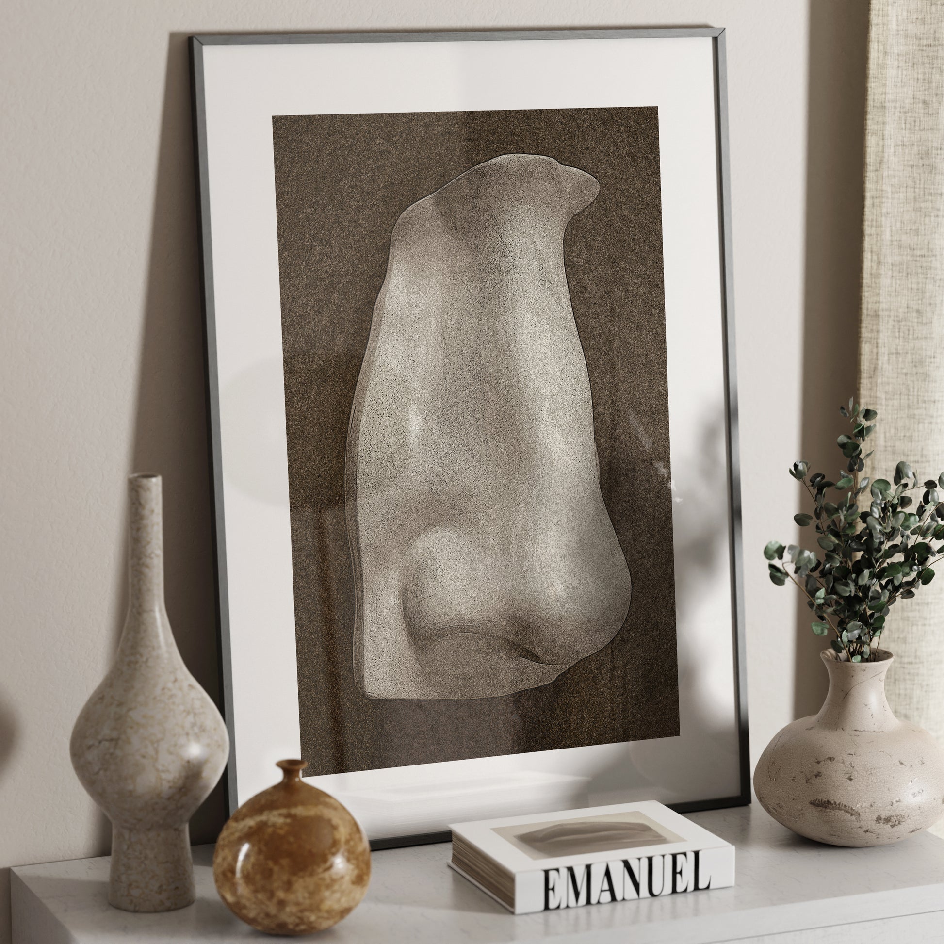 David's nose on a dark background, anatomy art print on a sideboard.