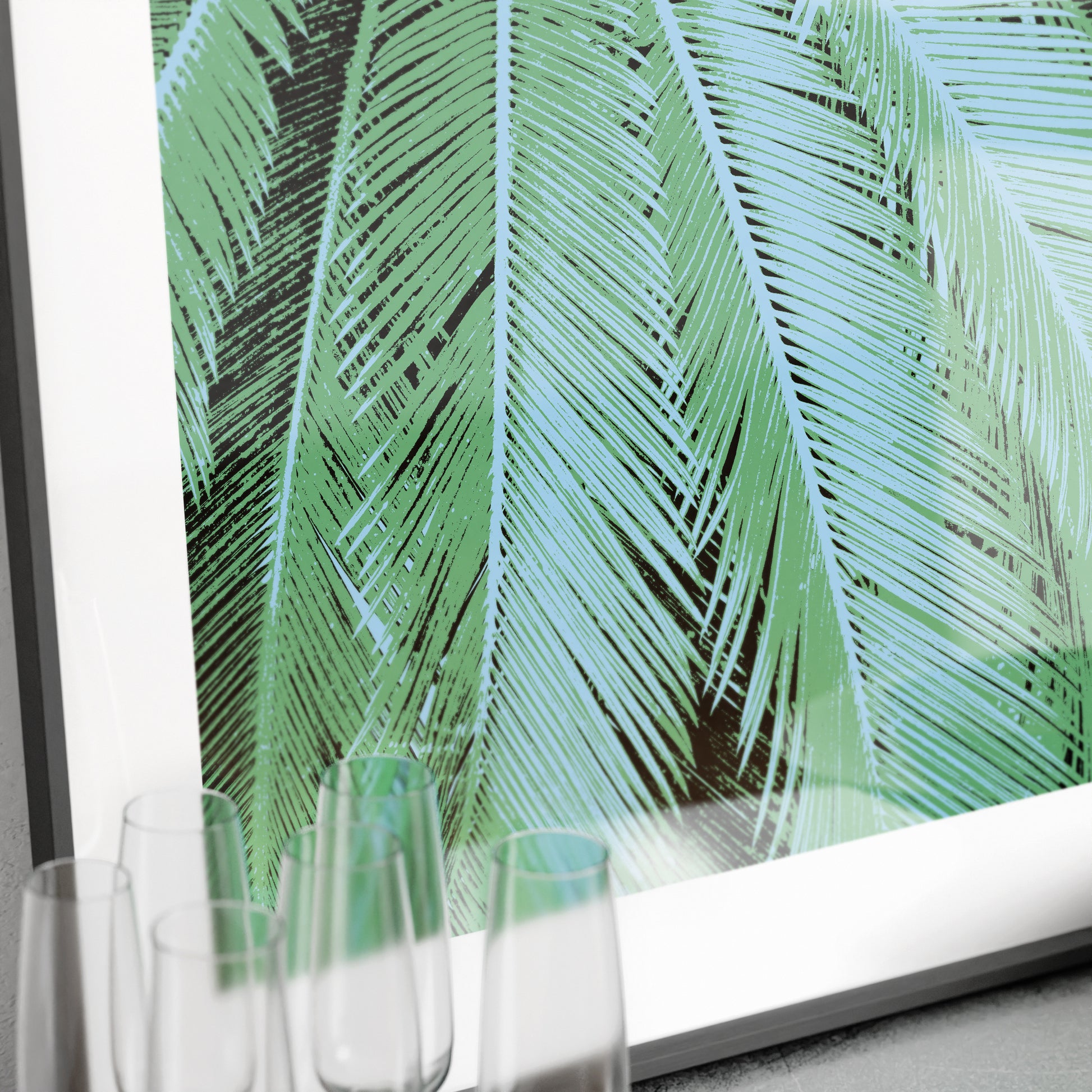 Framed artwork with green leaf pattern on a white background
