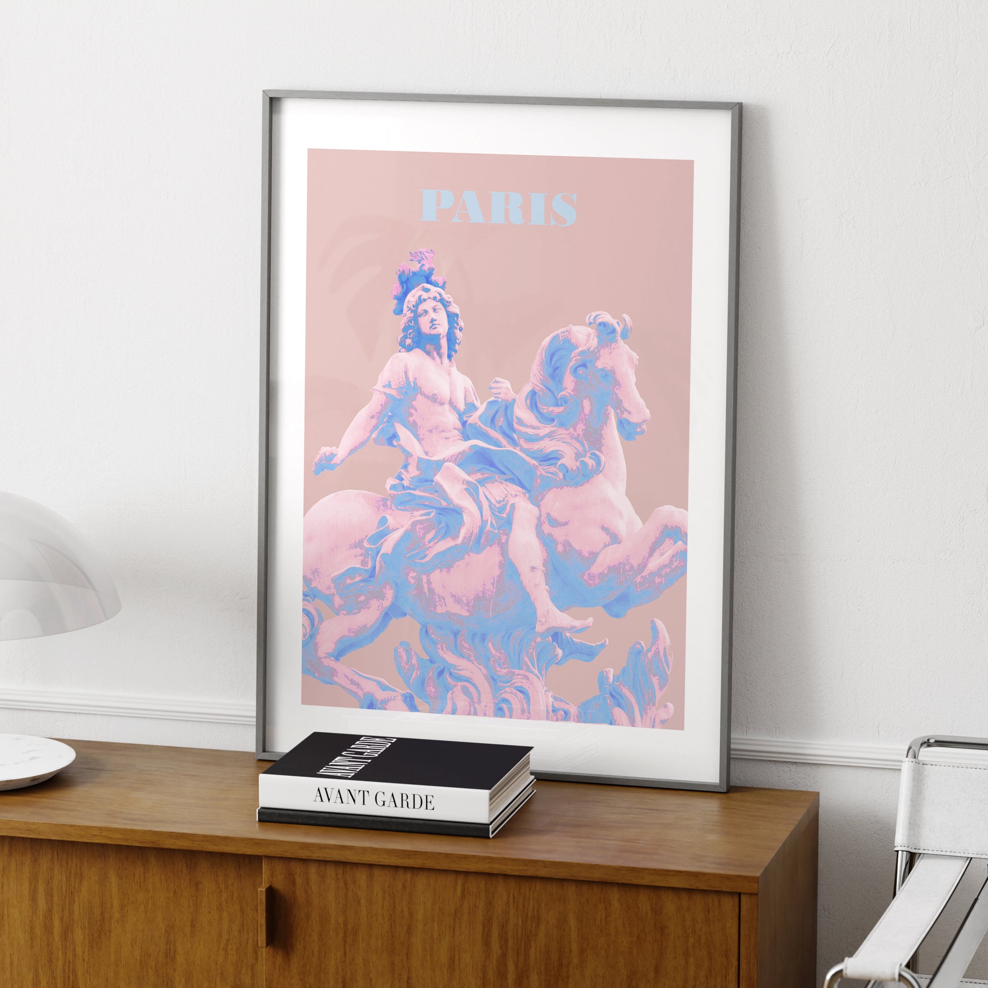 Travel poster Paris landmark pastel colors art print on a wood sideboard.