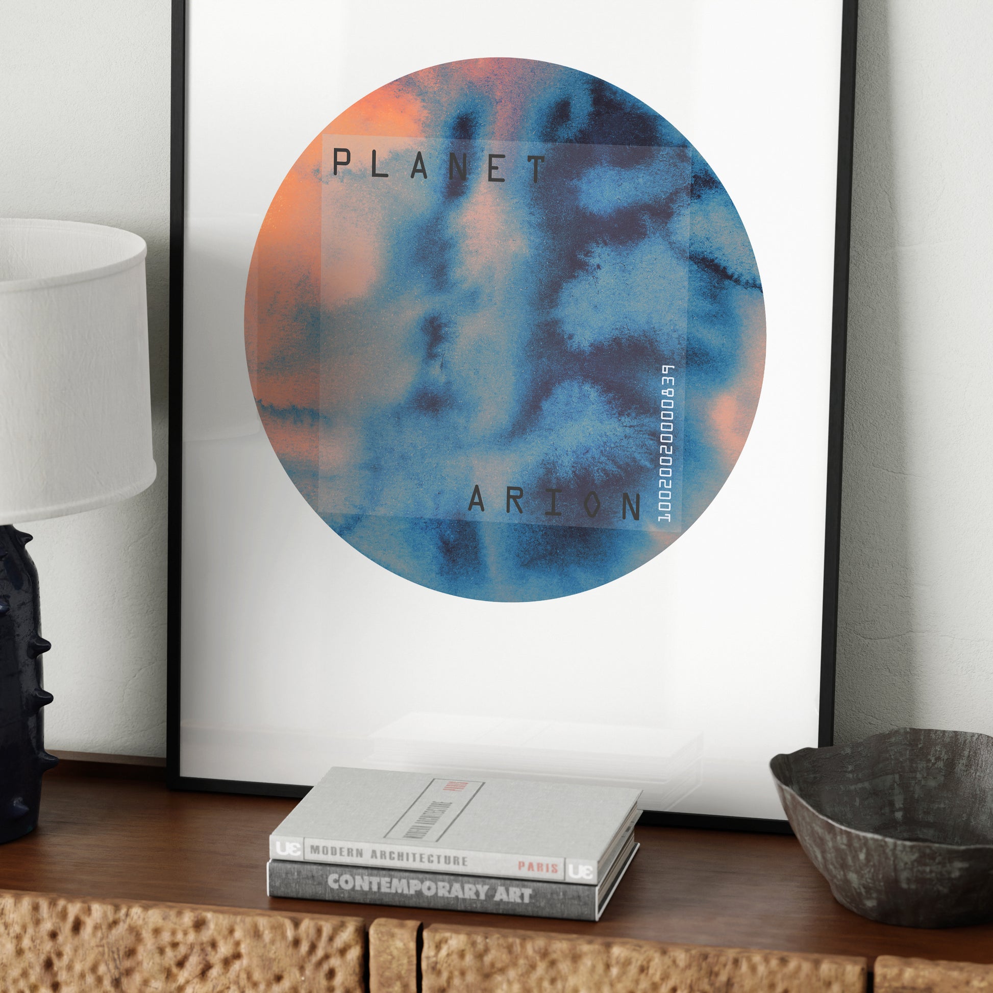 Blue and orange planet, minimalist watercolor graphic art print, on a sideboard.