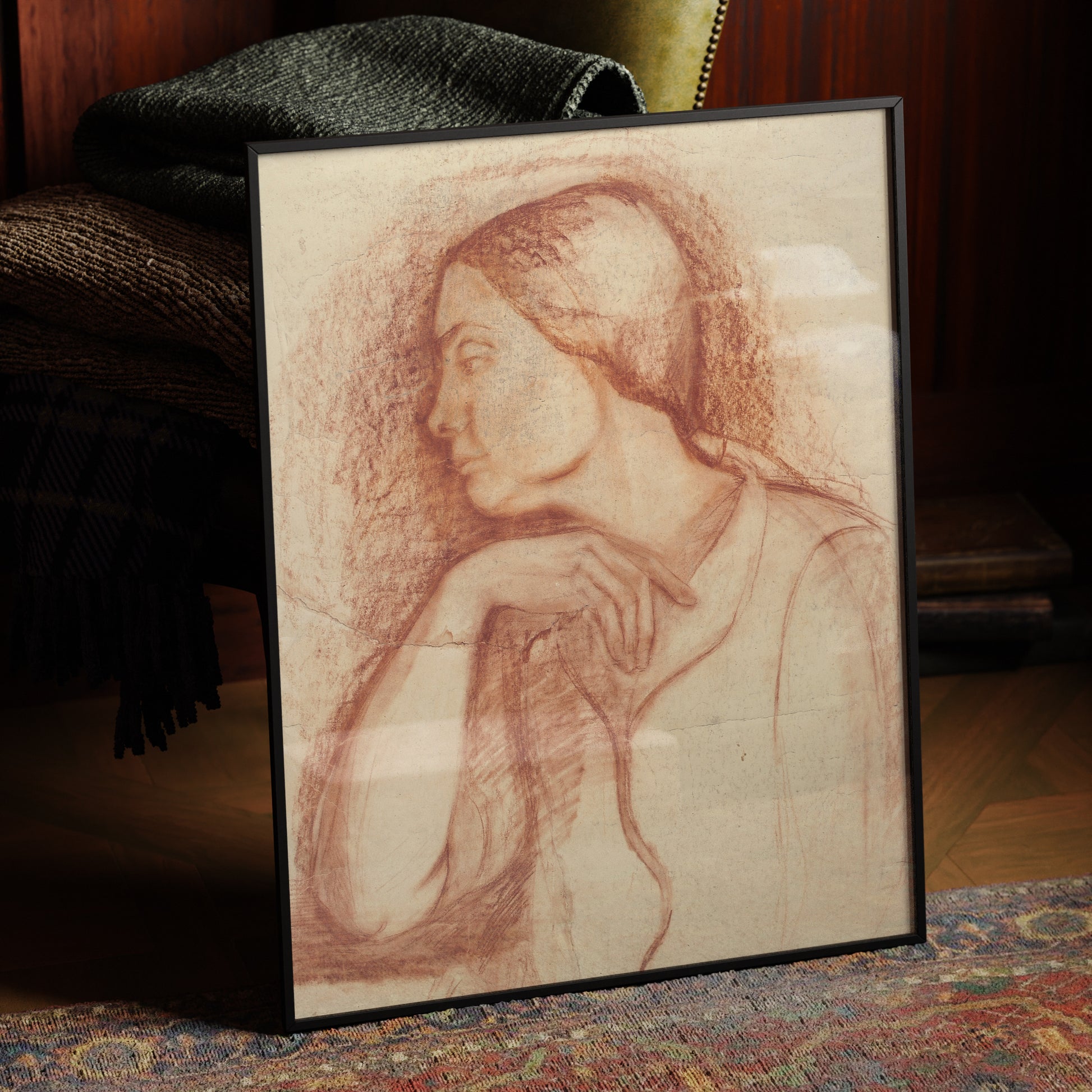 Framed fine art print depicting a sanguine portrait of a lady, in a dark, moody interior.
