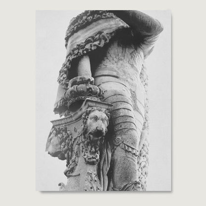 Black and white photography paper art print with a sculpture of a lion with decorative elements on a plain background.