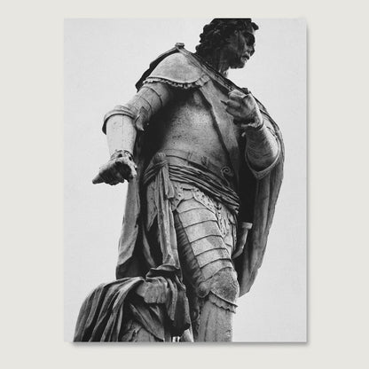 Black and white photography art print with a statue of a person in armor on a white background.