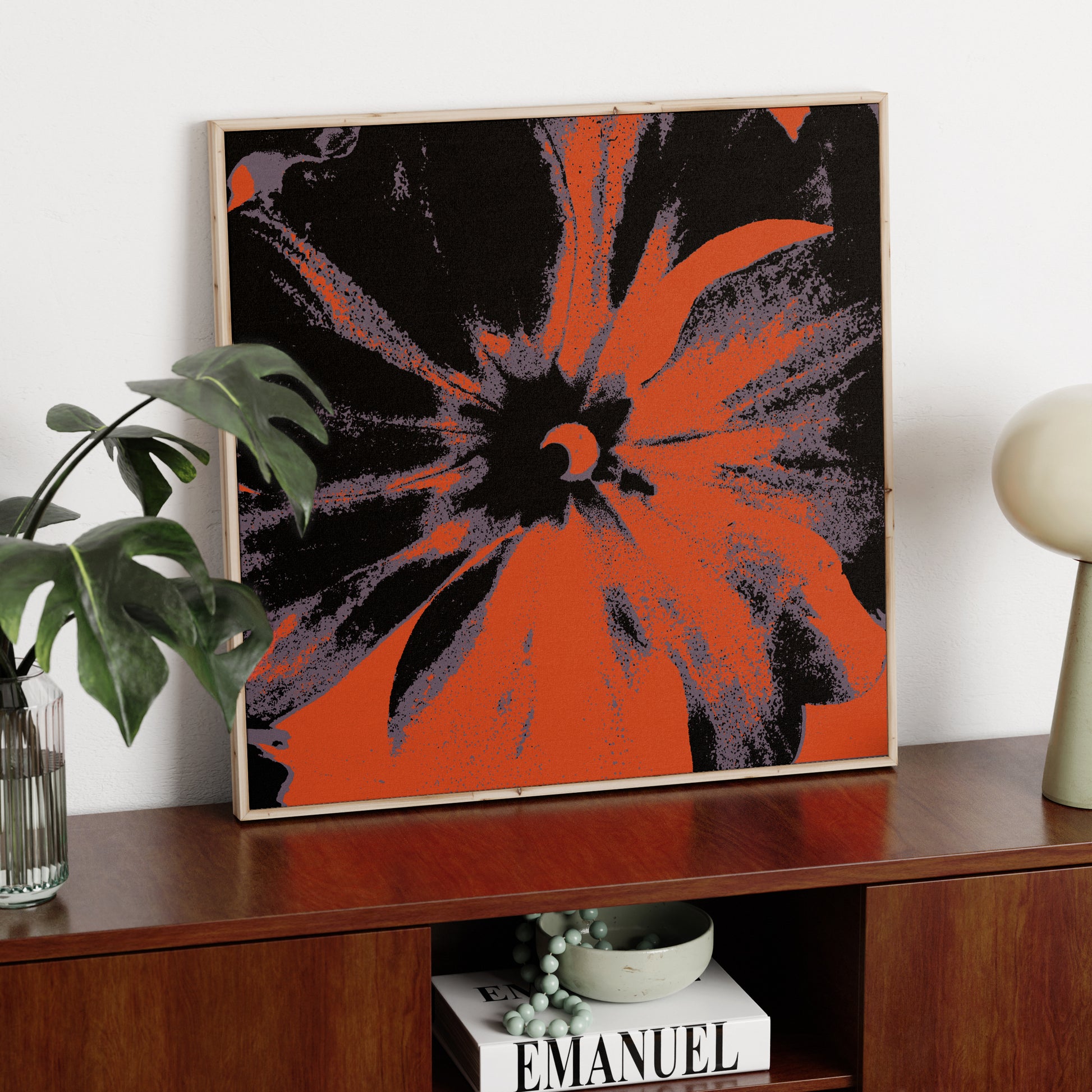 Black and red flower pop art art print on a solid wood sideboard.
