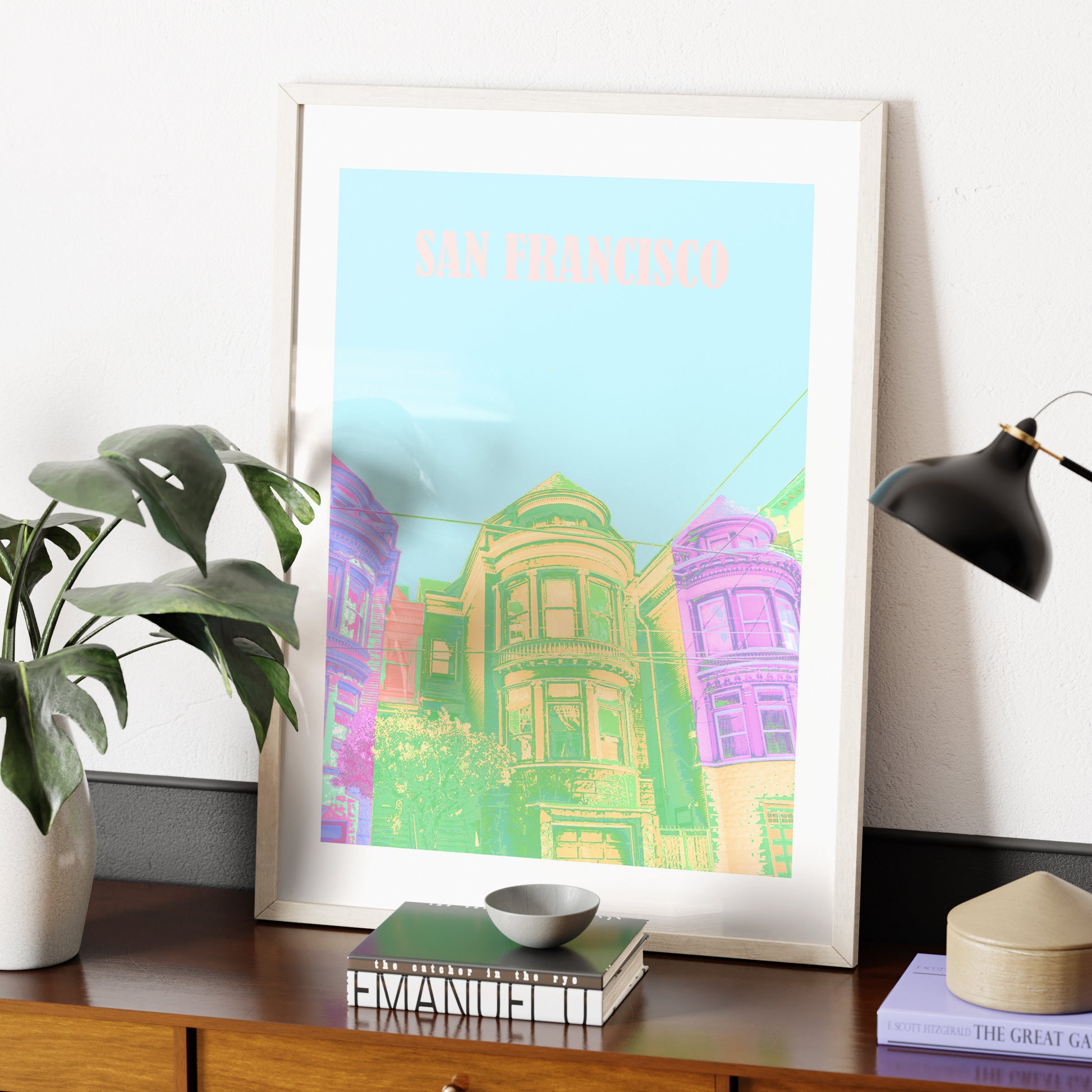Travel poster San Francisco landmark colorful art print on a sideboard.