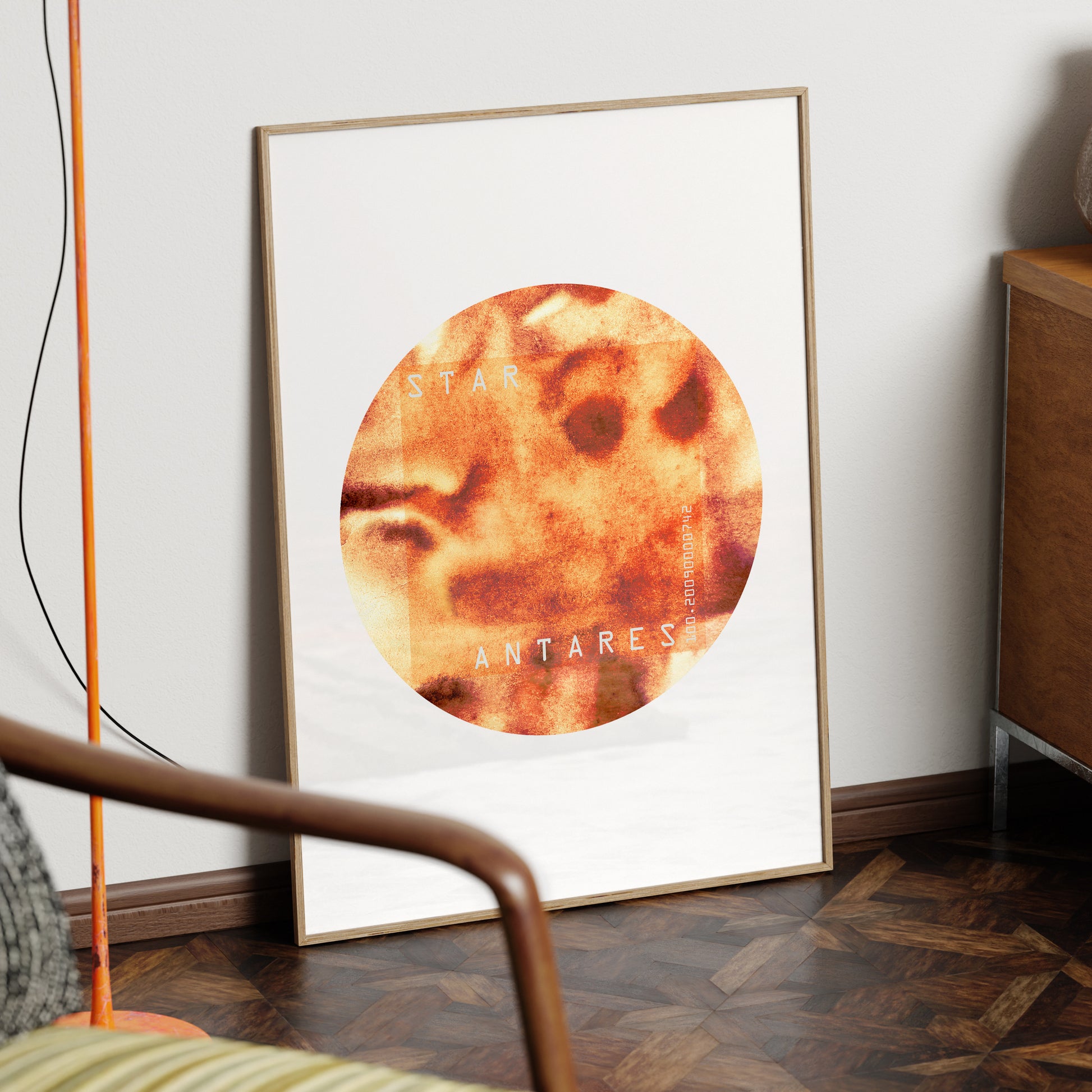 Star Antares minimalist graphic art print in a wood frame.