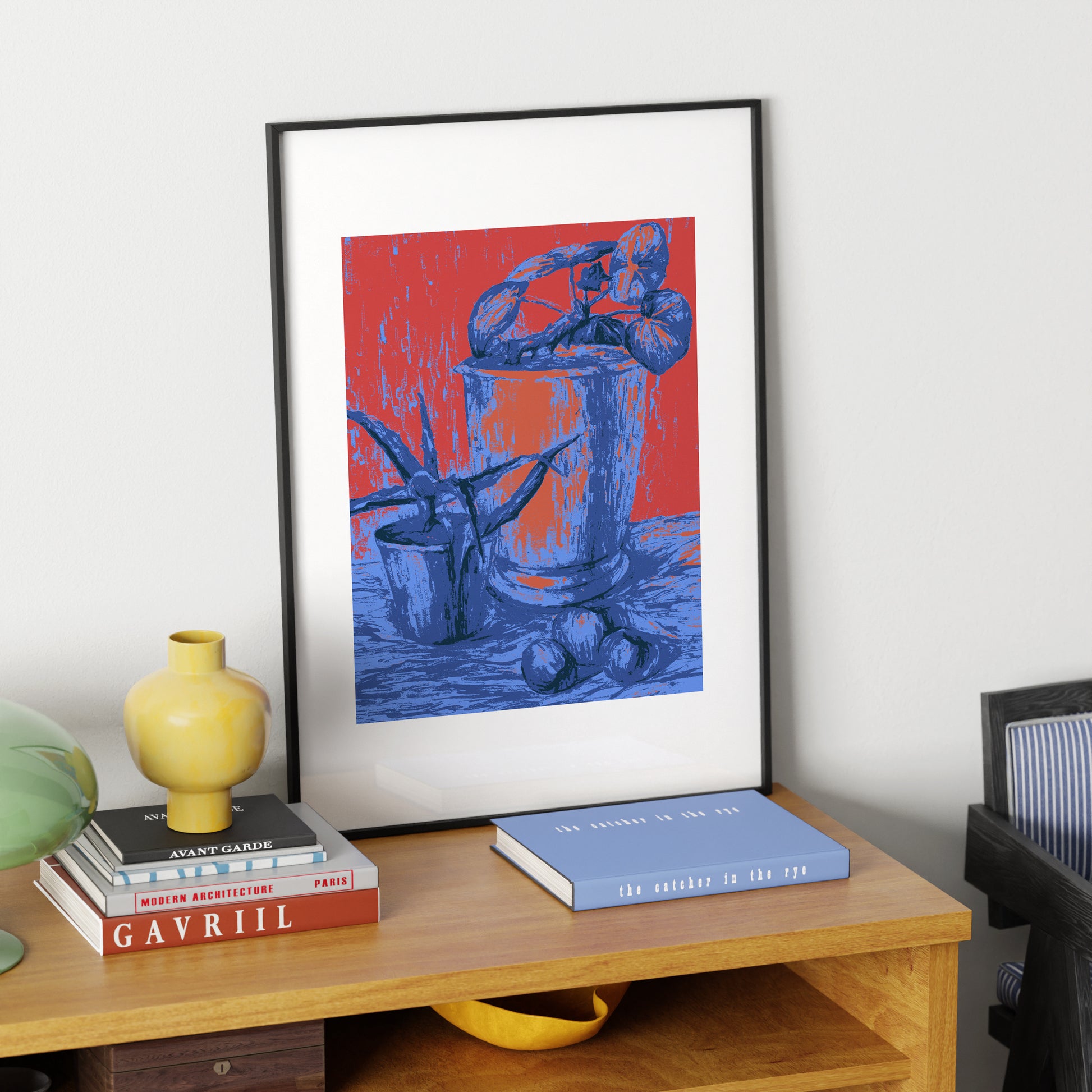 Red and blue still life with plants, pop, graphic art print on a sideboard.