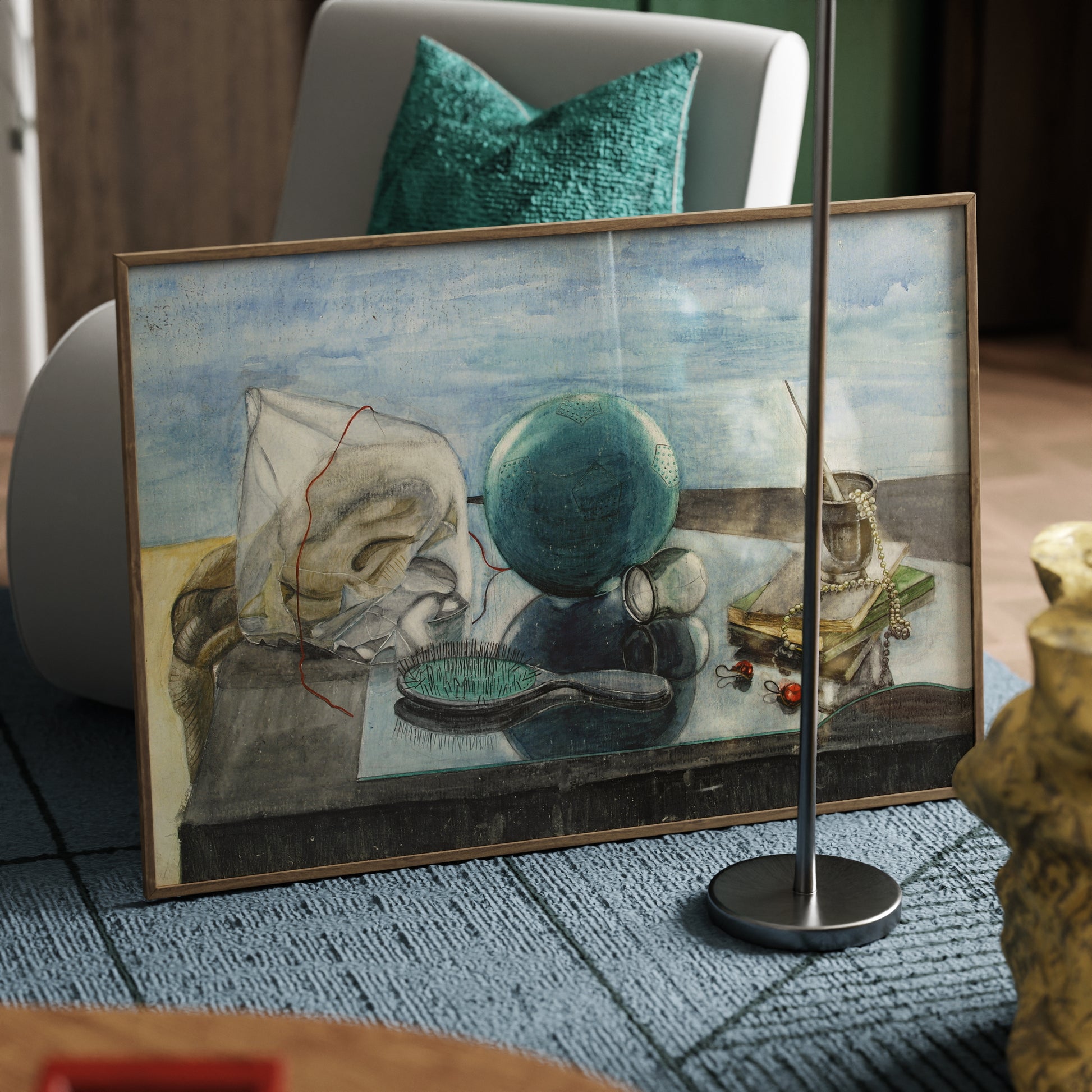 Framed figurative art print with blue-green ball, brush, books, white pearls and red diamond earrings on a glass, with a light blue sky on the background, in an eclectic modern interior.