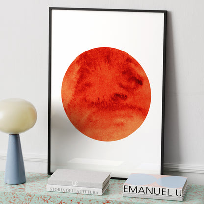 Intense red Sun, minimalist graphic art print on a modern sideboard.