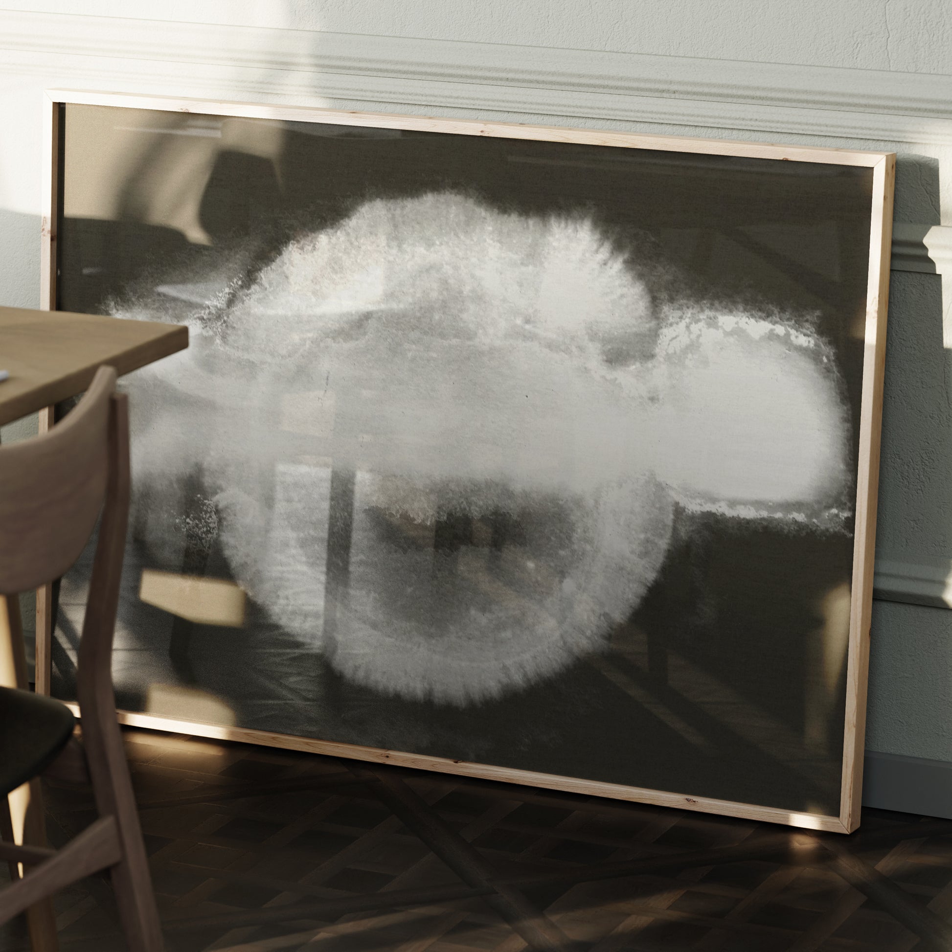 Abstract black and white art print in a wood frame.