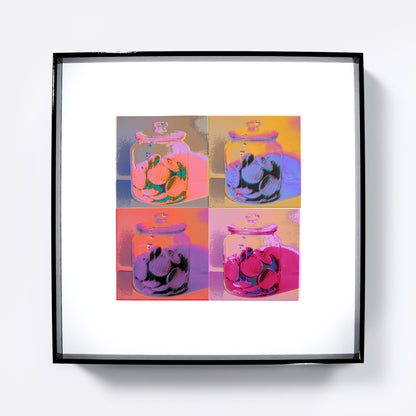 Framed artwork of a four-panel design with jars full of cookies on a white background.