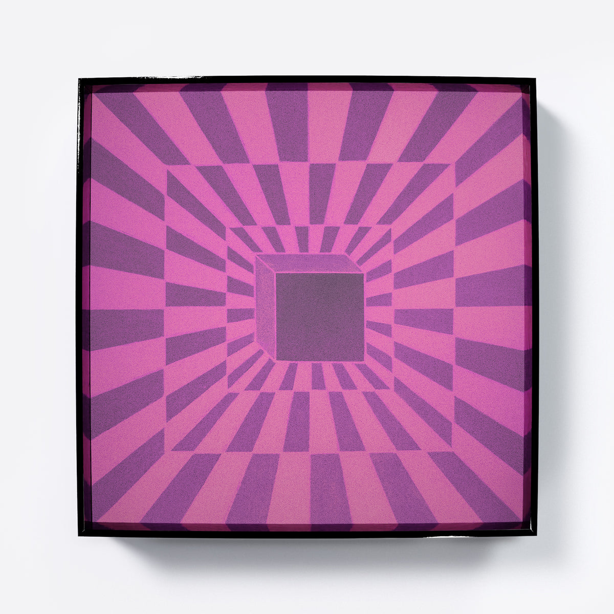 Framed artwork with a purple and pink geometric pattern.