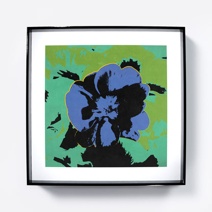 Pop art print with a blue flower on a green background.