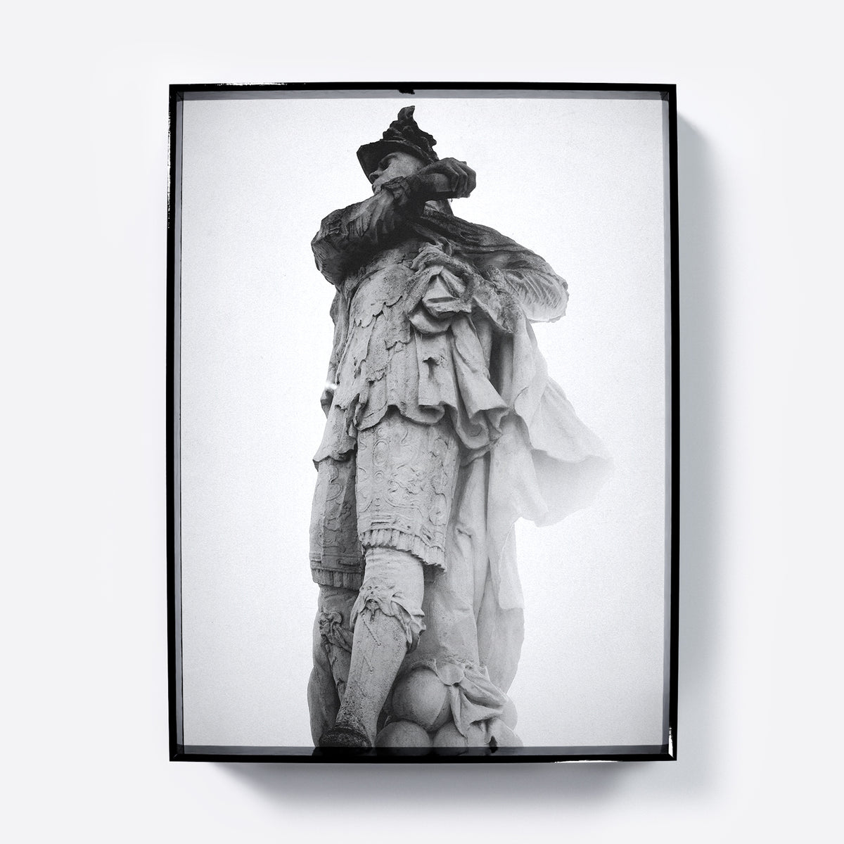 Framed black and white photograph art print of a classical statue against a light gray background.