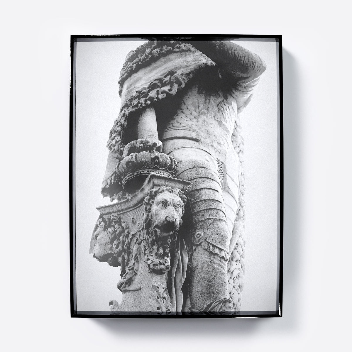 Framed black and white photograph art print of a detailed stone sculpture with a lion's head.