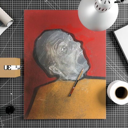 An unframed contemporary art print depicting the portrait of a shouting actor sitting on top of a work table