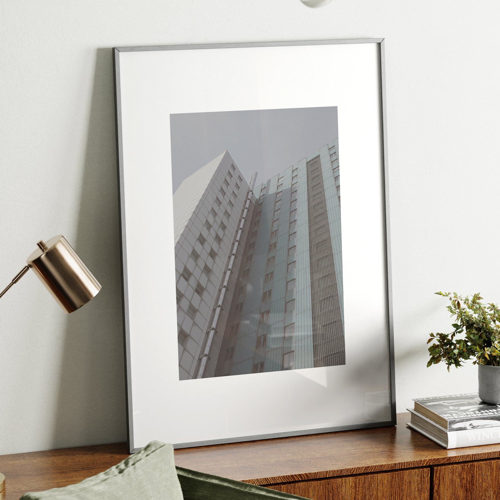 Pale colors urban photography art print on a wood sideboard.