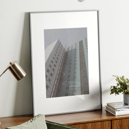 Pale colors urban photography art print on a wood sideboard.