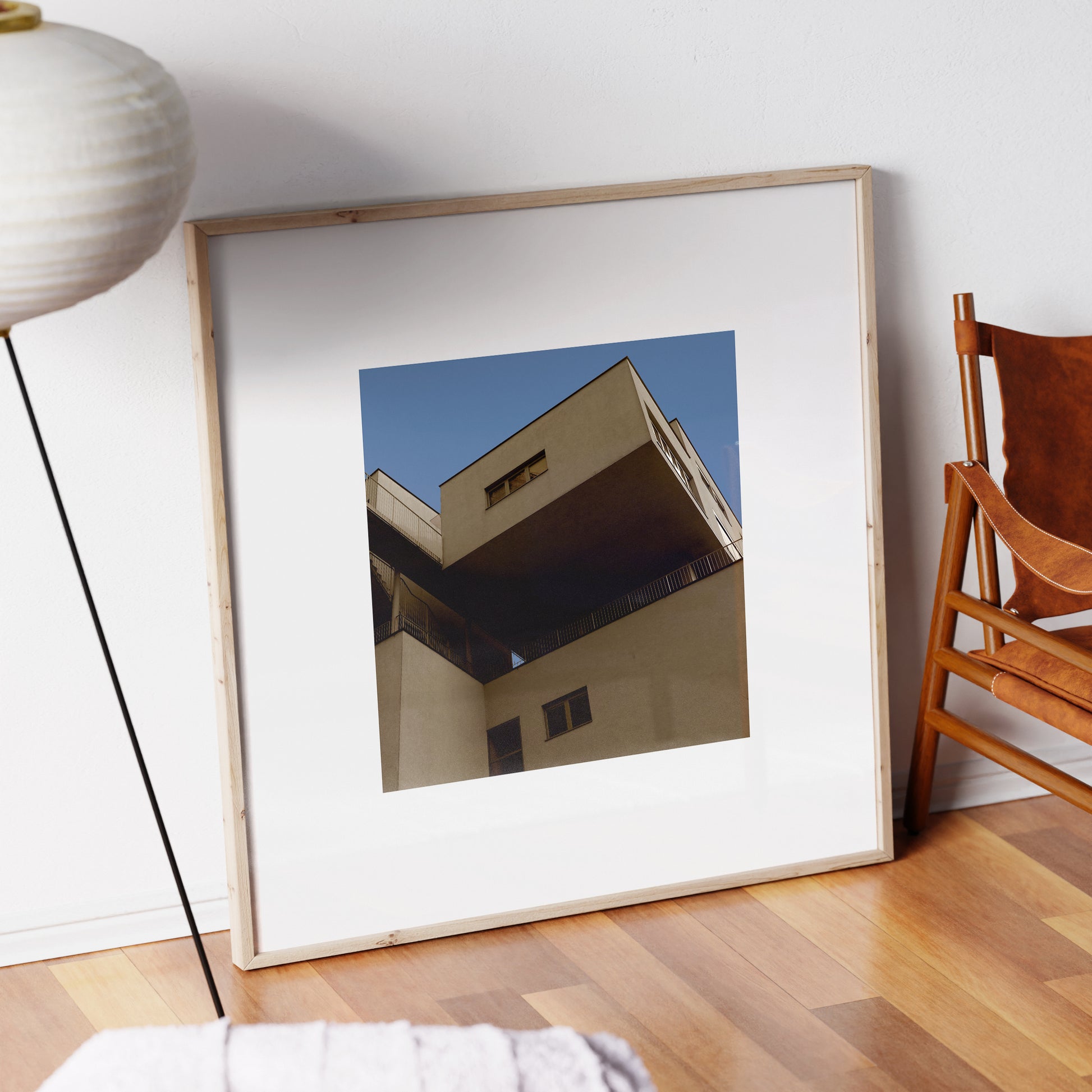 Brutalist, modern architectural corner in Vienna, urban photography art print in a natural wood frame.