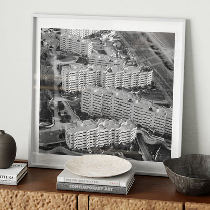 Black and white urban photography art print on a wood sideboard.