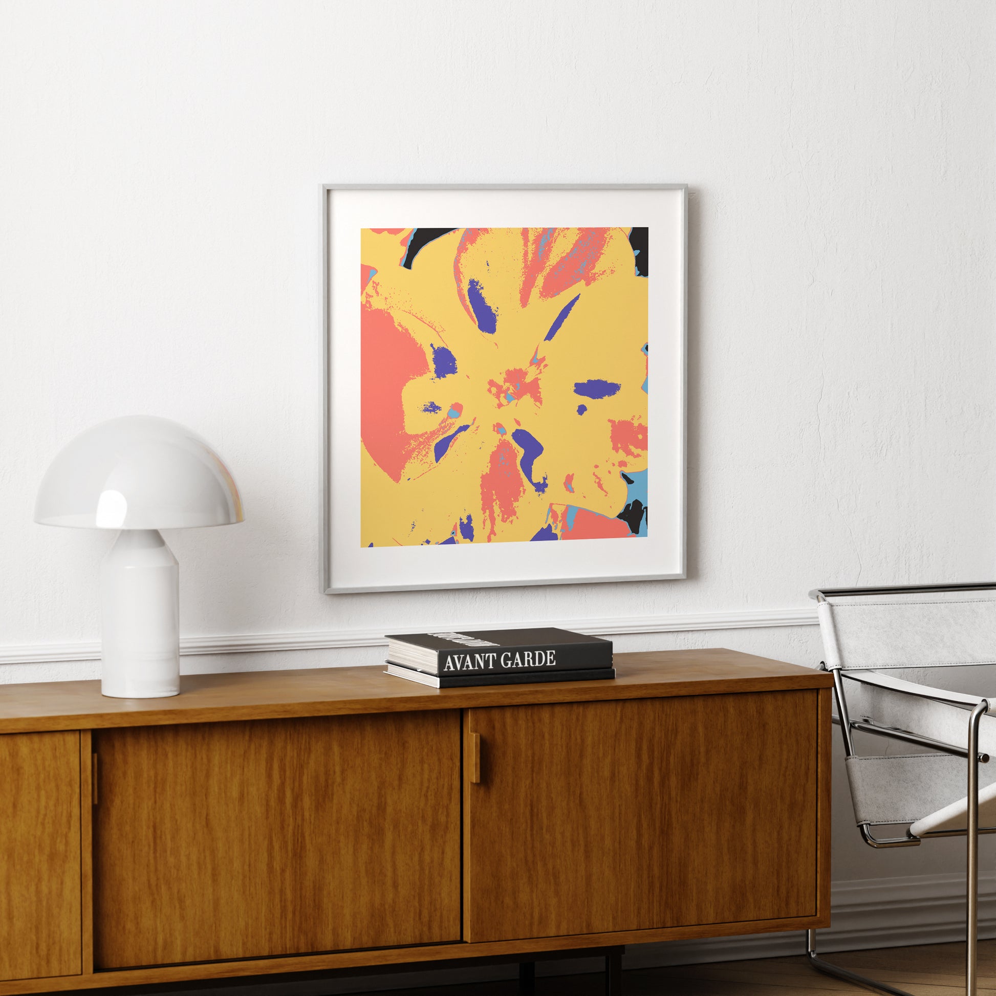 Colorful pop art print with a flower, above a vintage wood sideboard.