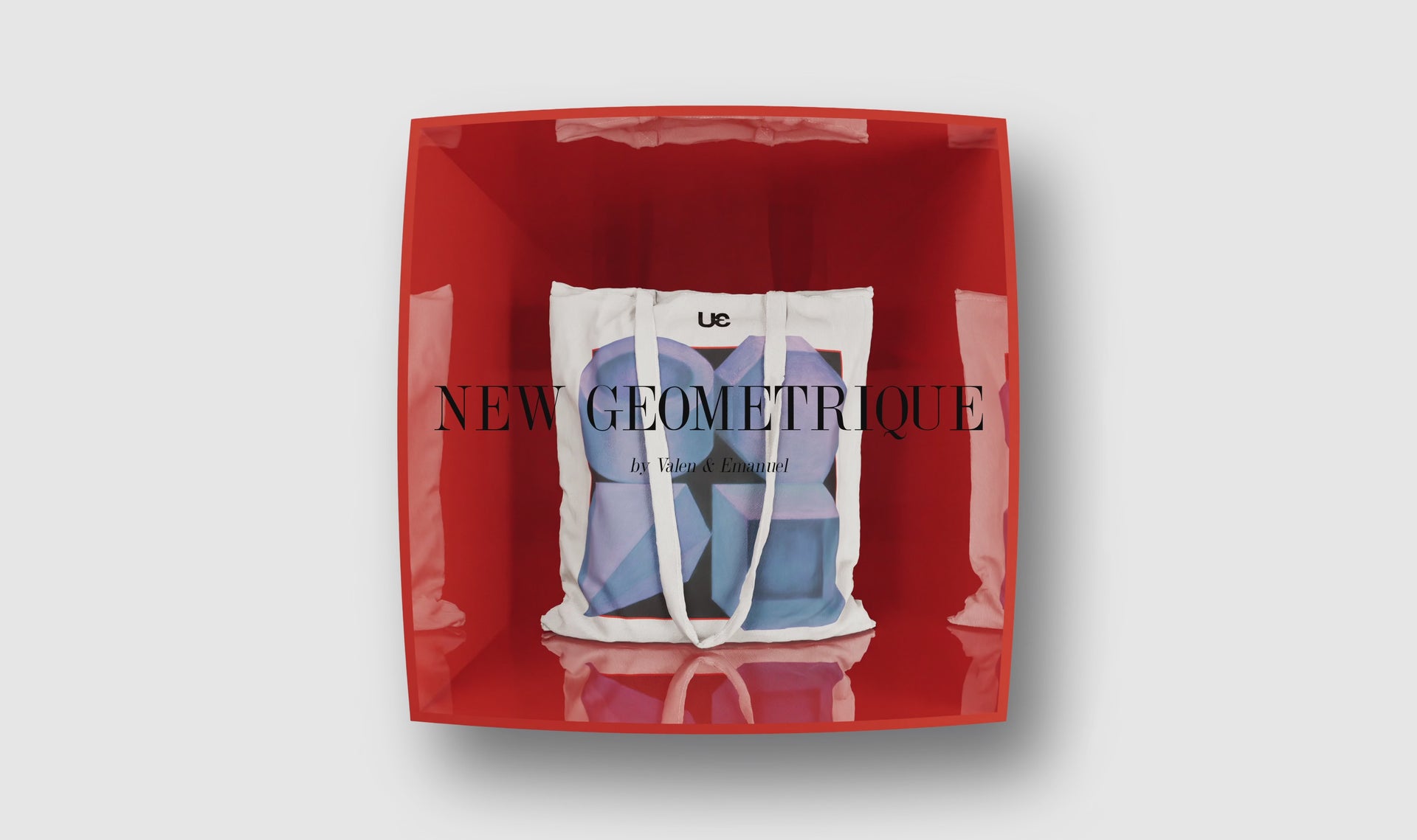 A video of a spinning tote bag with a geometric print on it in a striking red box teasing the Accessories collection.